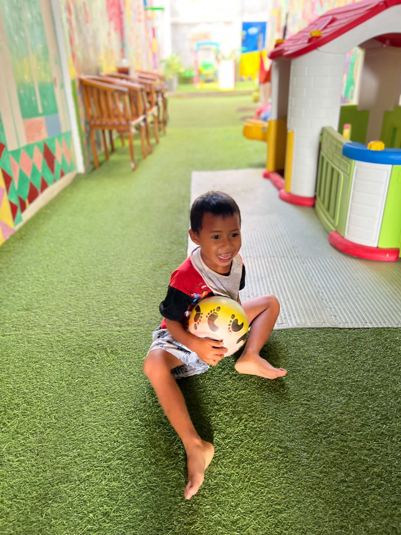 Volunteer holding smiling child